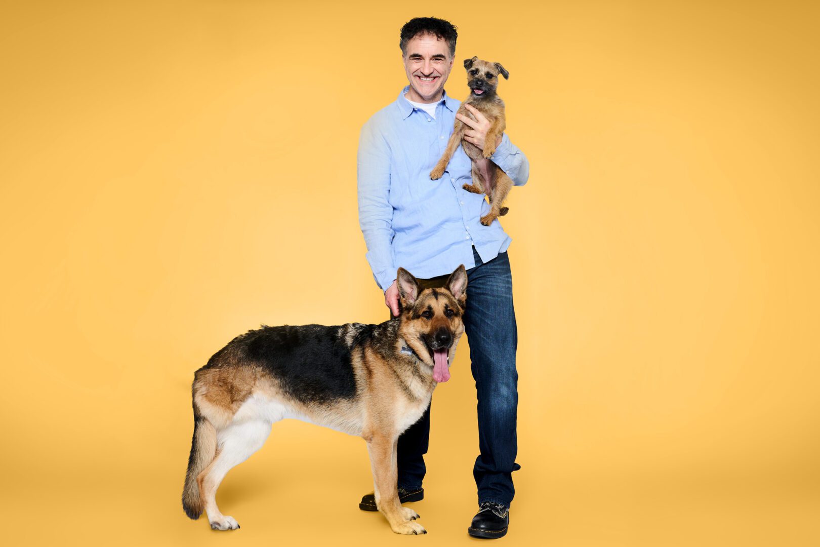 Professor Noel Fitzpatrick standing with a dog and a cat